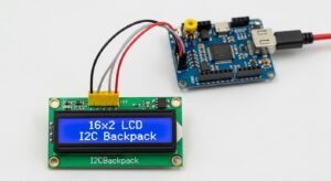 Image of a 16x2 LCD with an I2C backpack, showing reduced wiring with SDA and SCL connections to a microcontroller for simplified interfacing